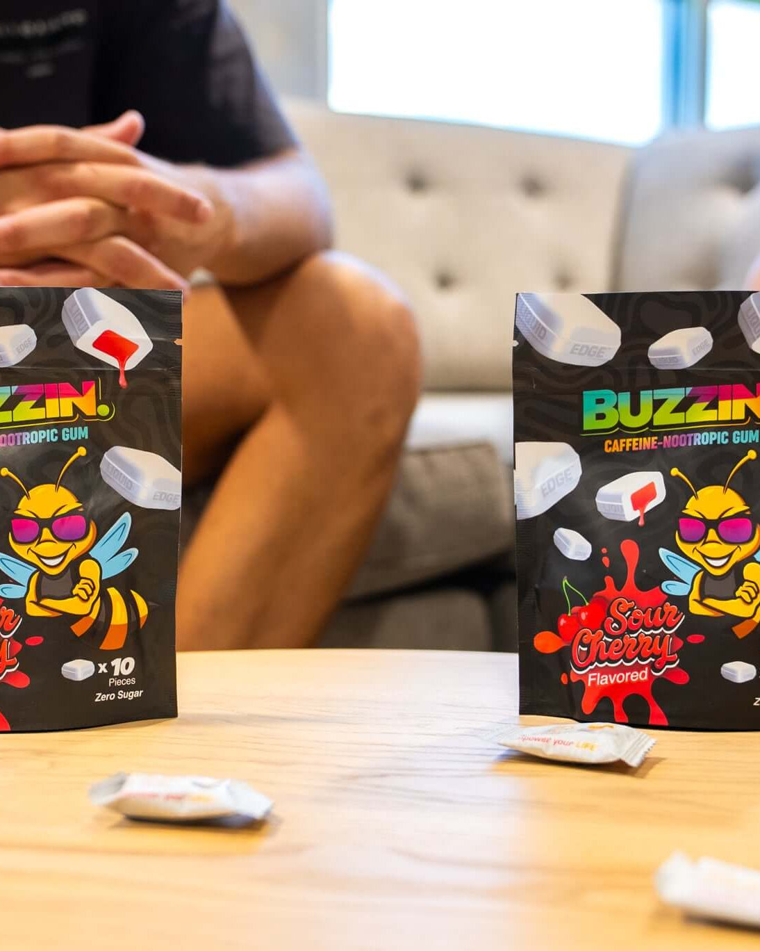 Person using Buzzin energy gum for focus and sustained energy