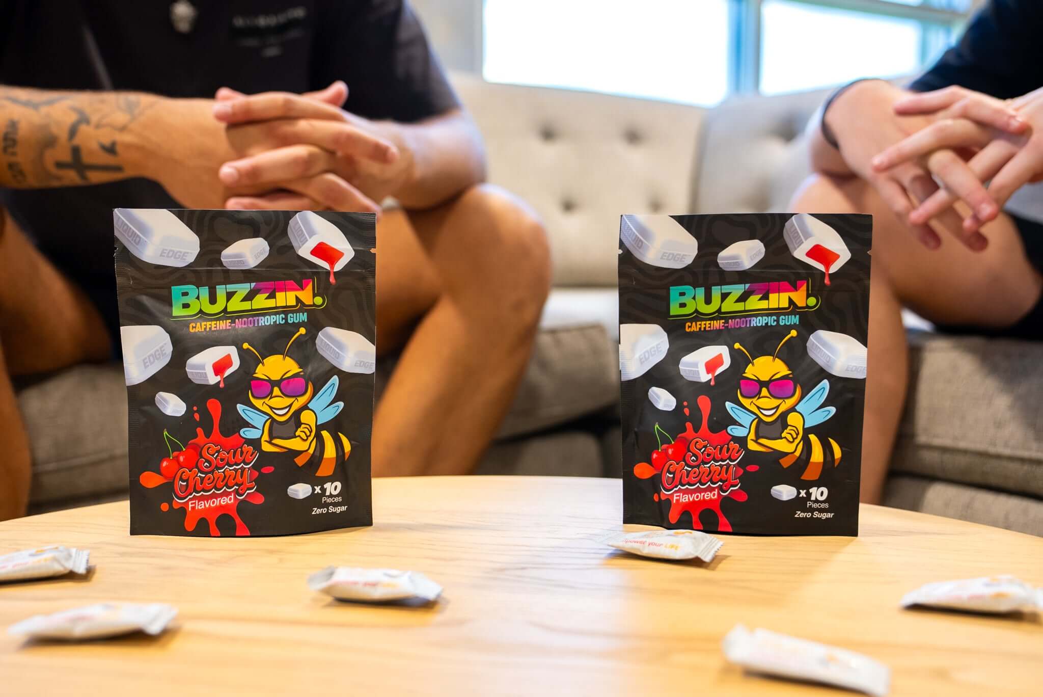 Person using Buzzin energy gum for focus and sustained energy